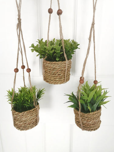 Artifical woven hanging planters with greenery 